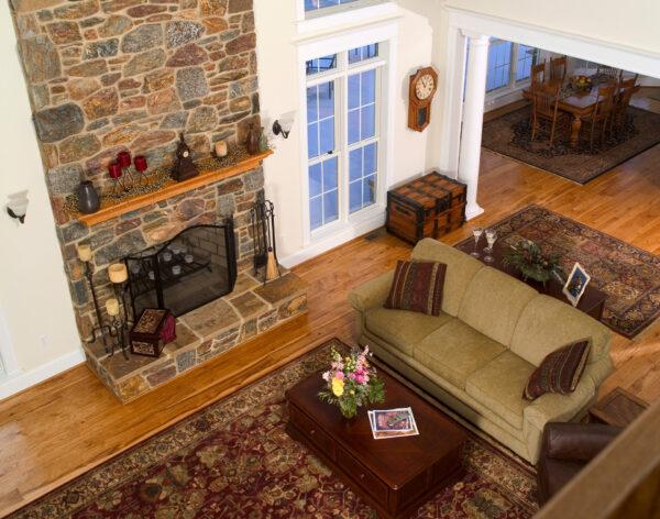 wide plank hickory floor surrounding fireplace in PA country home